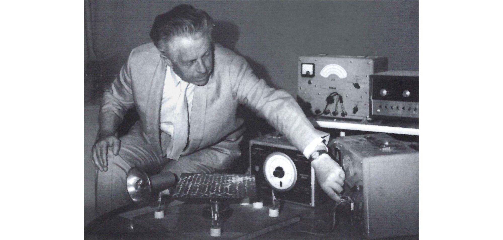 Photo of Hans Jenny with cymatics equipment