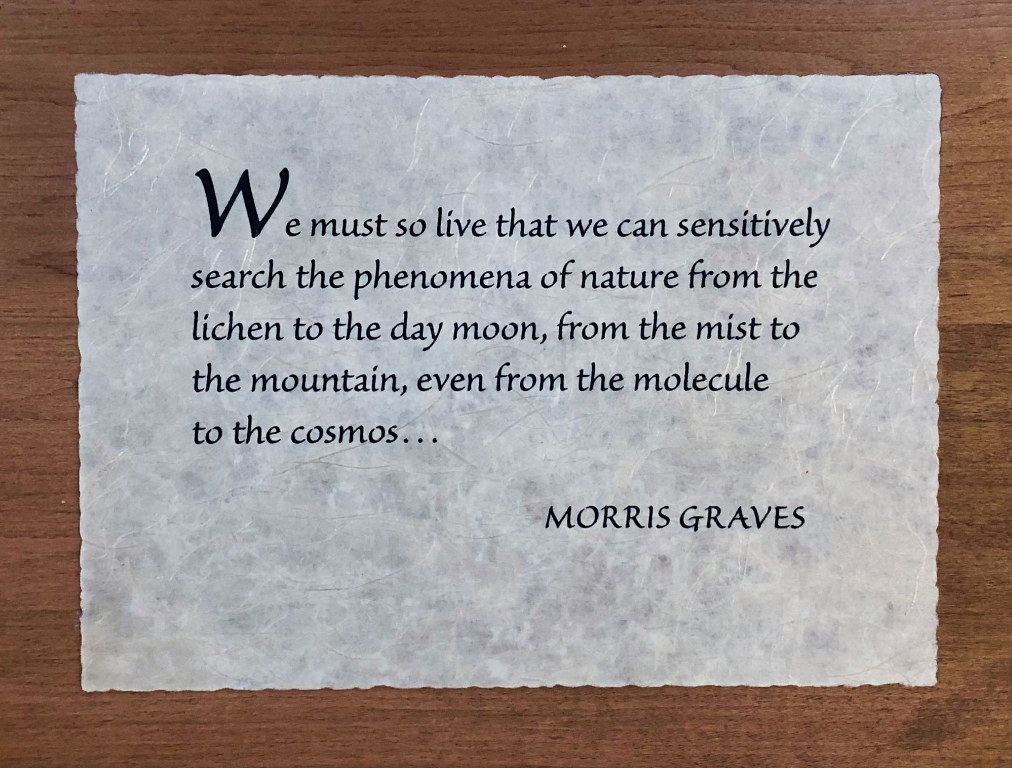 Photo of wooden plaque with Morris Graves quote: “We must so live that we can sensitively search the phenomena of nature from the lichen the day moon, from the mist to the mountain, even from the molecule to the cosmos.” 