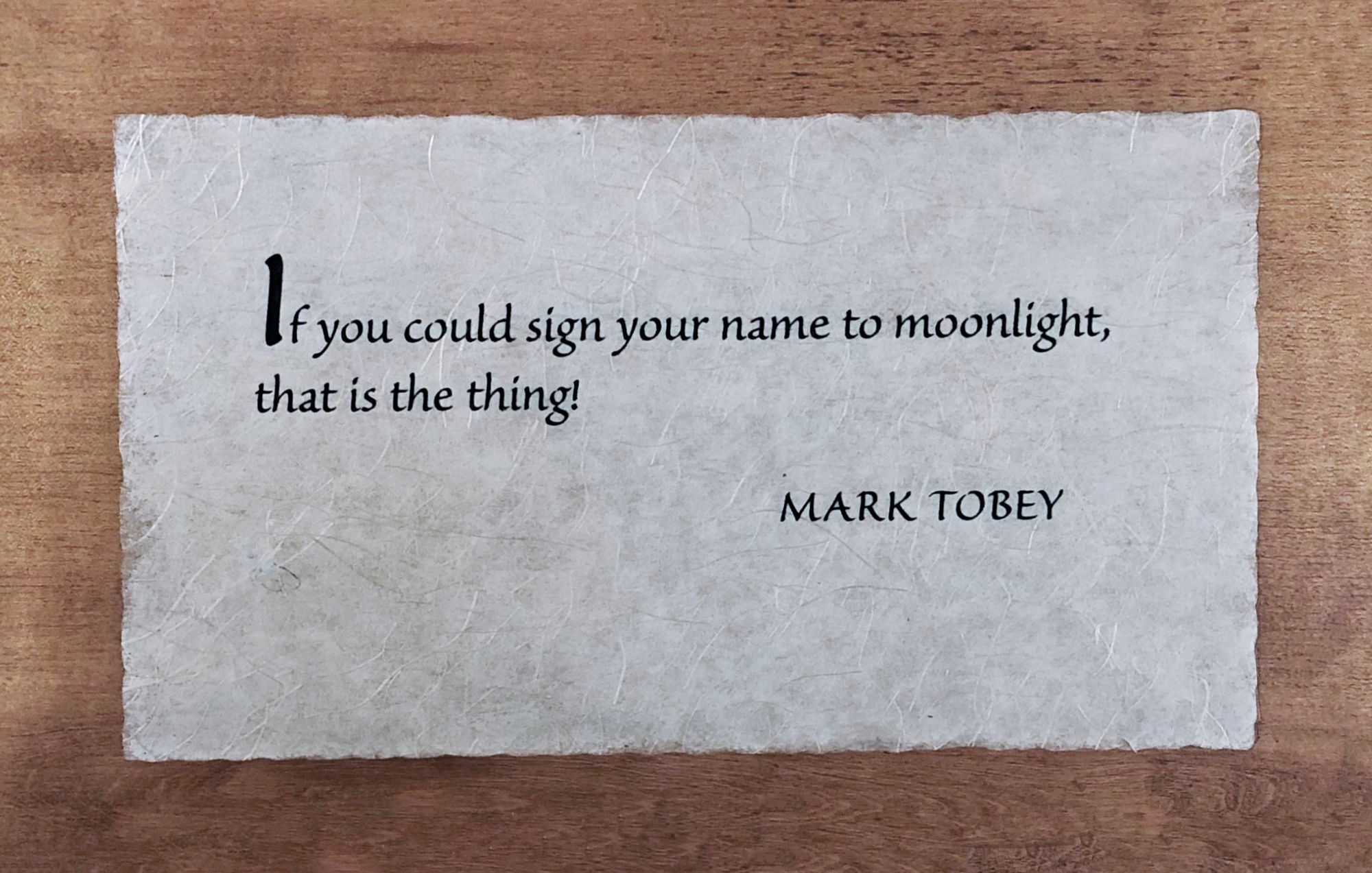 Photo of wooden plaque with Mark Tobey quote: “If you could sign your name to moonlight—that is the thing!”
