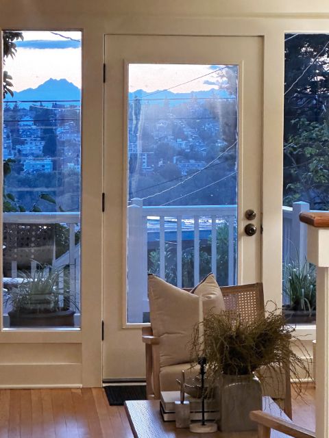 Photo of The Brothers mountains through Sandra Dean's front door, by David Bilides