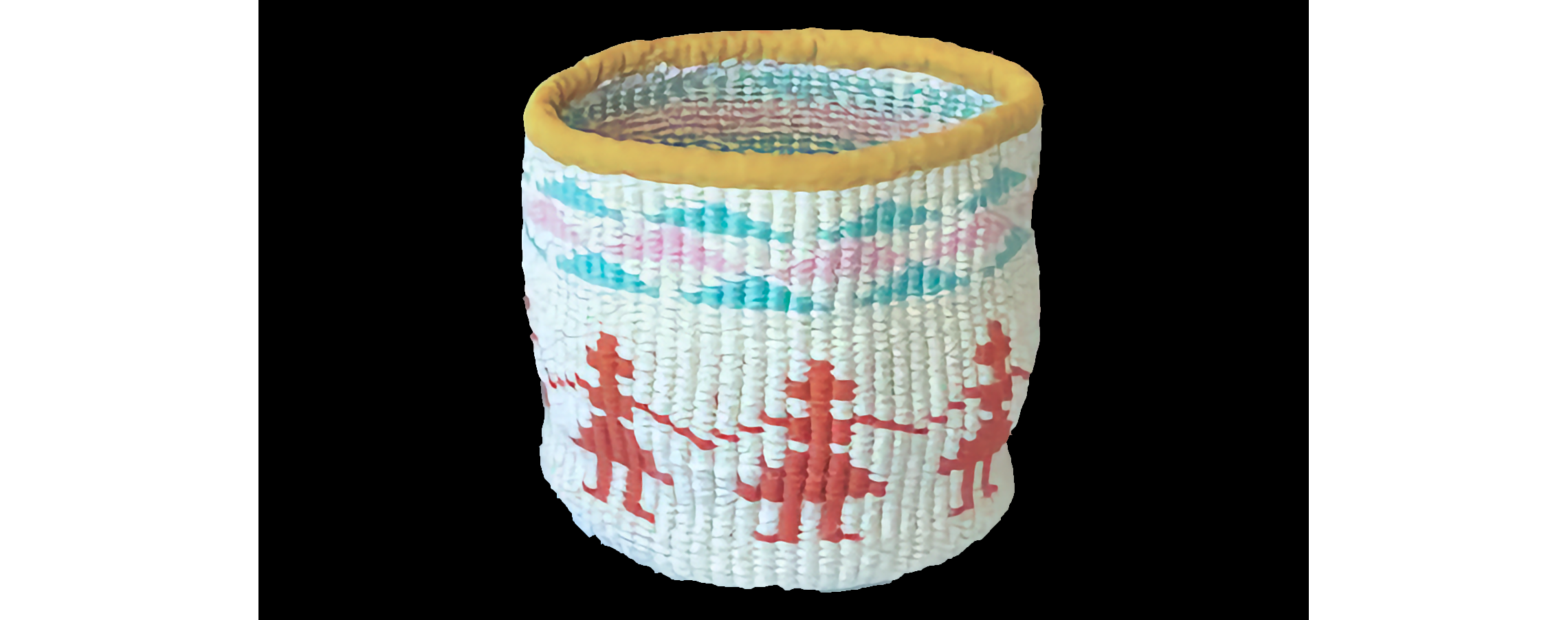 Closeup of traditional basket in white with red figures holding hands, blue and pink triangles at top, and golden lip all around