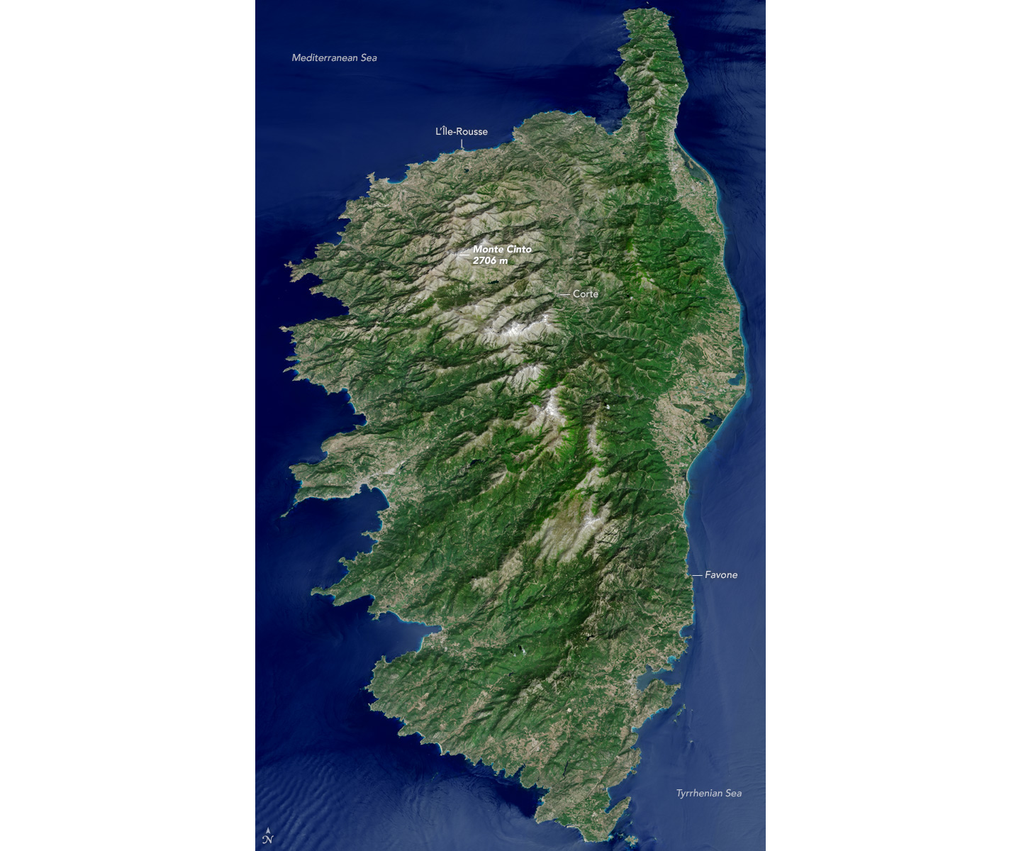 Satellite photo of Corsica, showing entire island covered in green with a brown mountainous spine