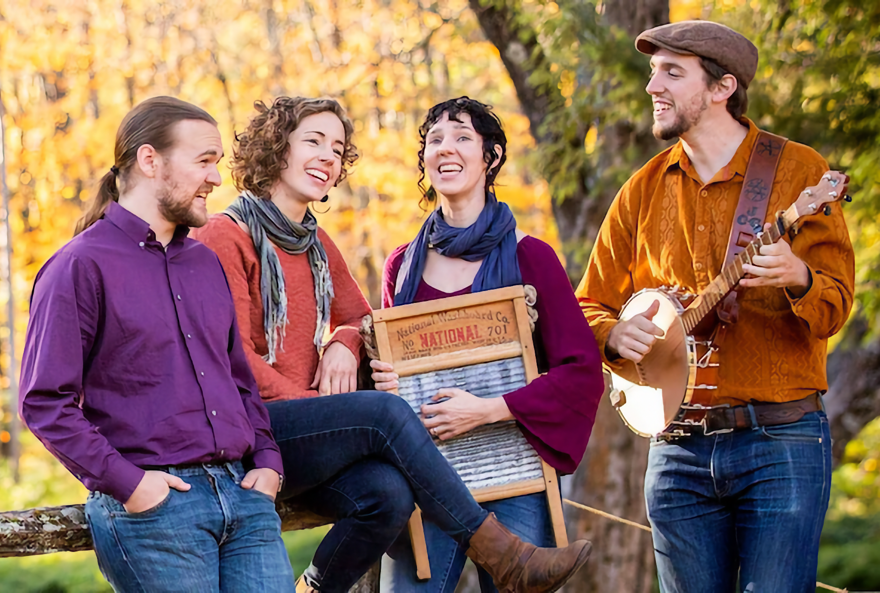 Photo 4-member singing group Windborne, outside including a banjo and a washboard